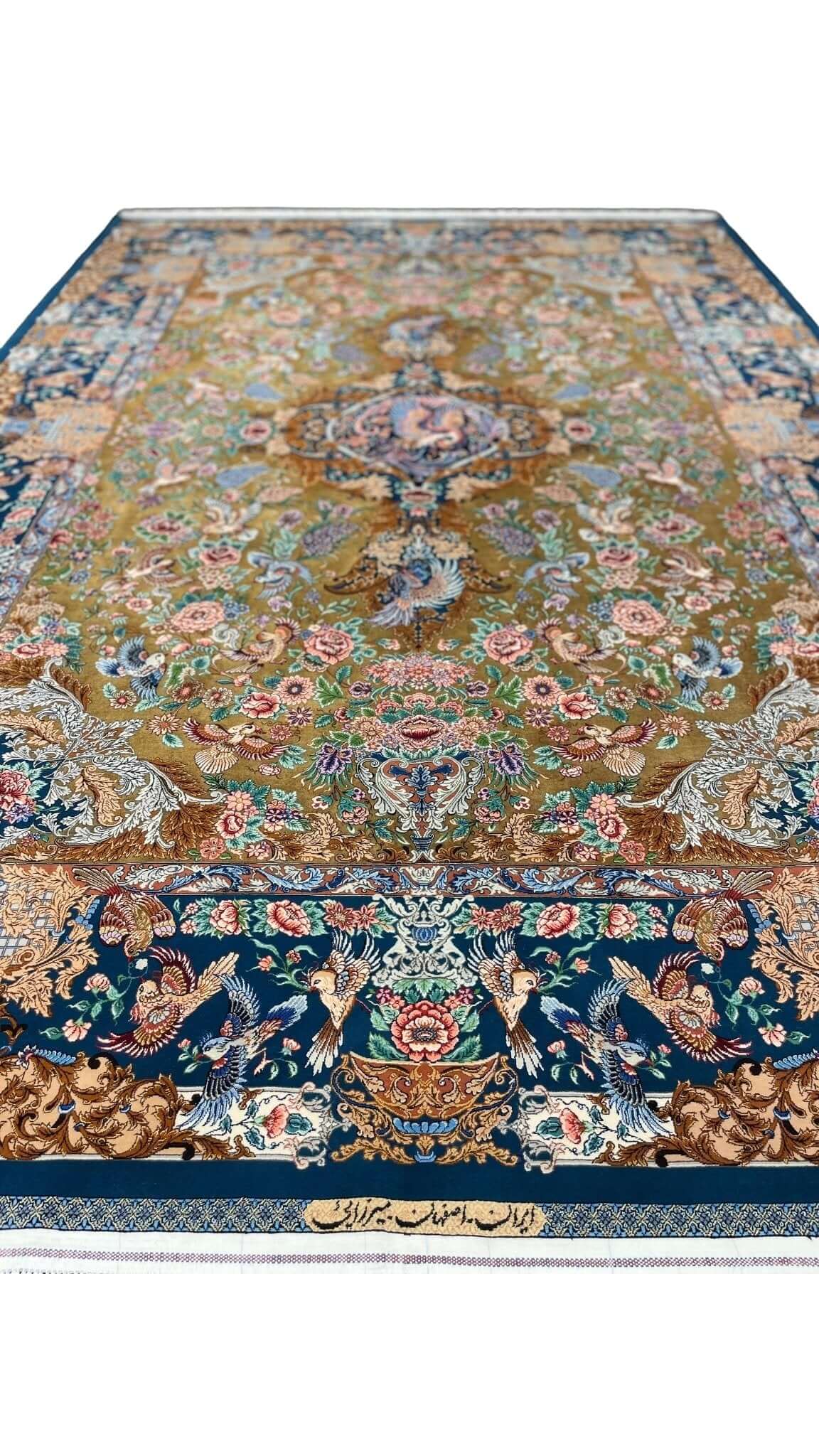 "Golden silk Persian rug hand-knotted by Mirzaie in Iran."